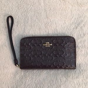 Coach patent leather wine colored wristlet